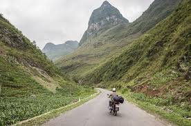Who should be engaging on an adventure motorbike tour from Vietnam to Laos?